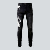 White embroidery black skinny jeans