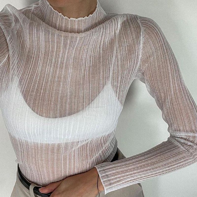 Bonita blusa de malla transparente con copos de nieve, cuello alto y dobladillo con volantes