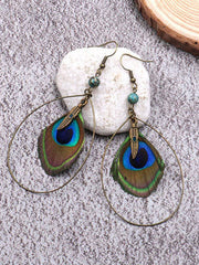 Hermosos pendientes de plumaje de pavo real