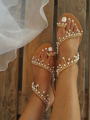 Sandalias planas con perlas brillantes