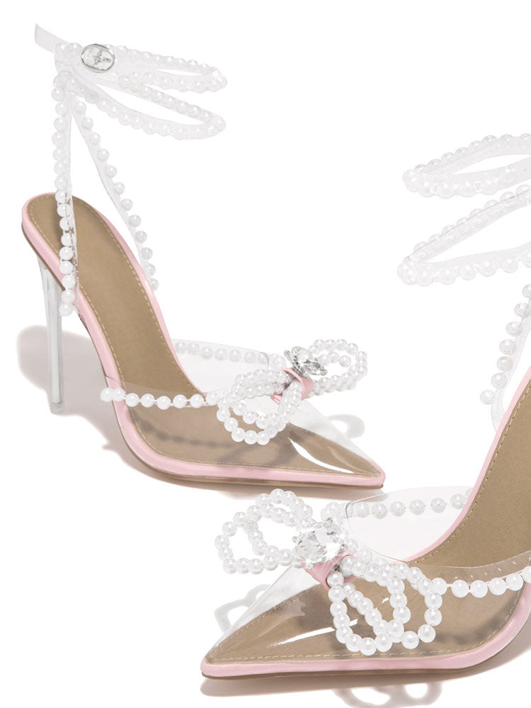 Transparente High Heels mit spitzer Spitze und Perlenschleife